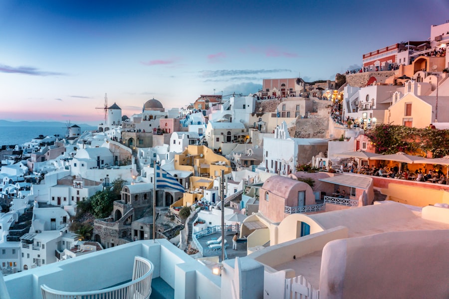 The whitewashed houses of Oia above the Santorini caldera at dusk